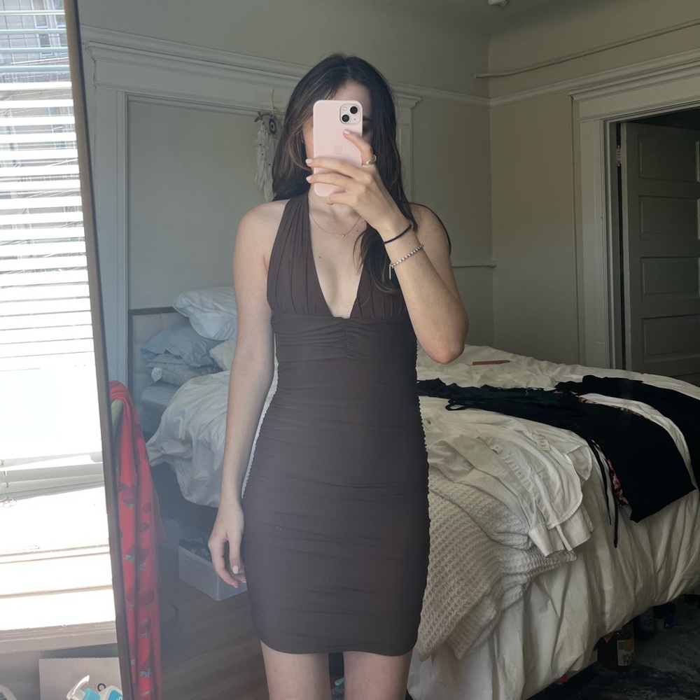 Tiger mist Carmen’s brown strappy dress
